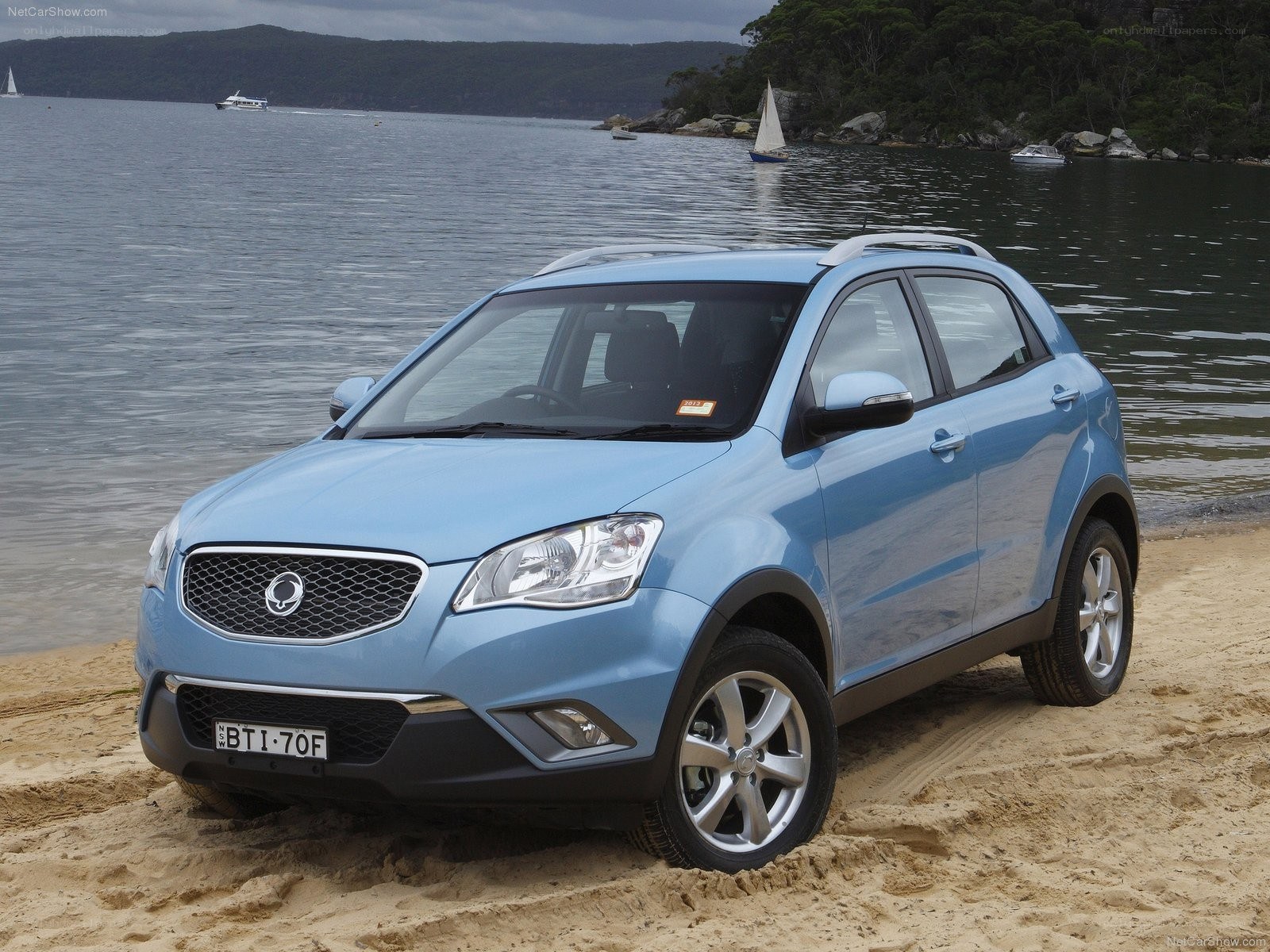 Blue SUV on a sandy beach