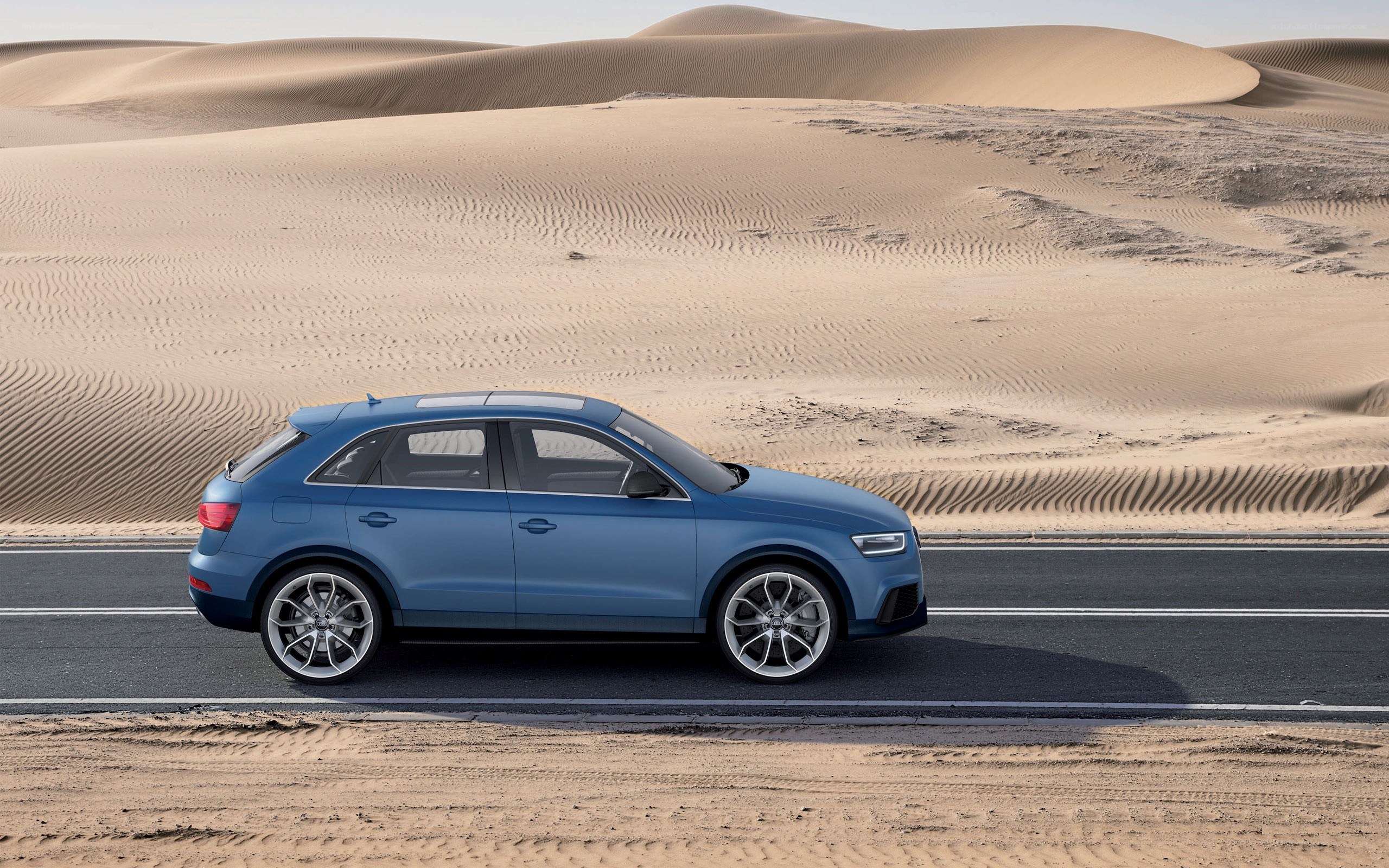 Blue SUV on desert road