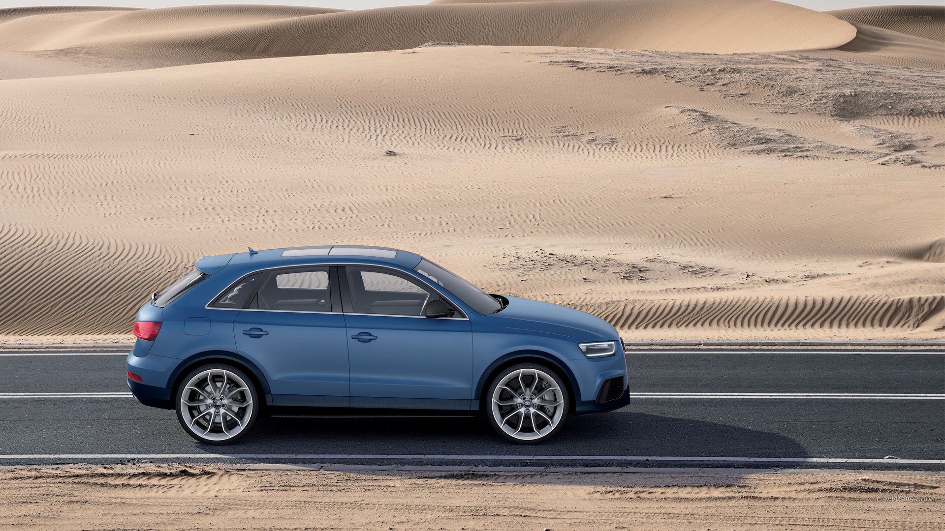 Blue SUV on desert road