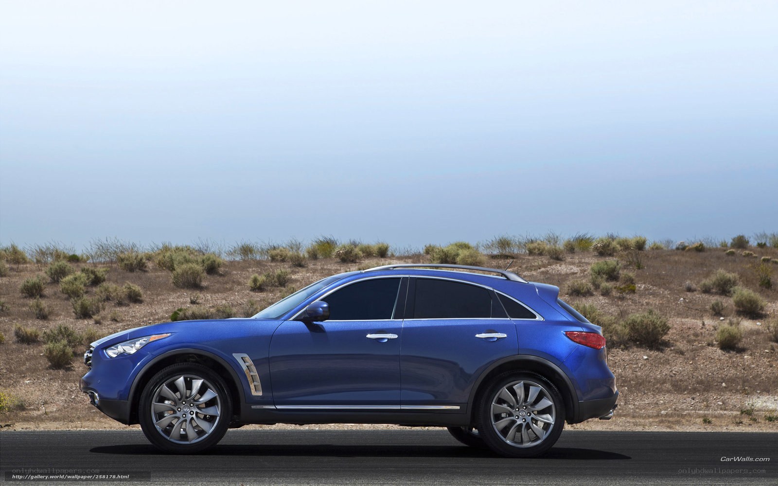 blue suv on desert road