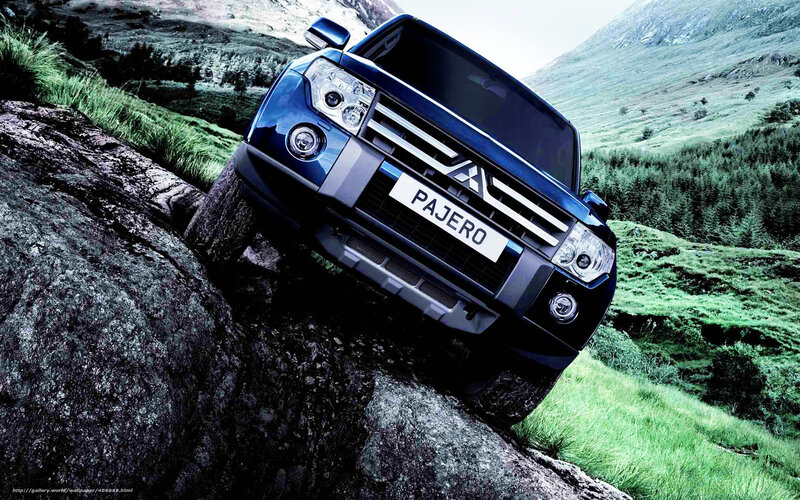 Blue SUV on Rocks — Dramatic