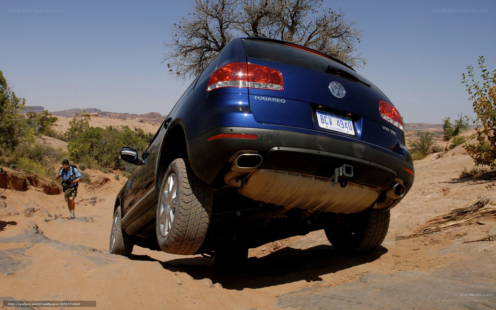 Blue SUV on rocky terrain