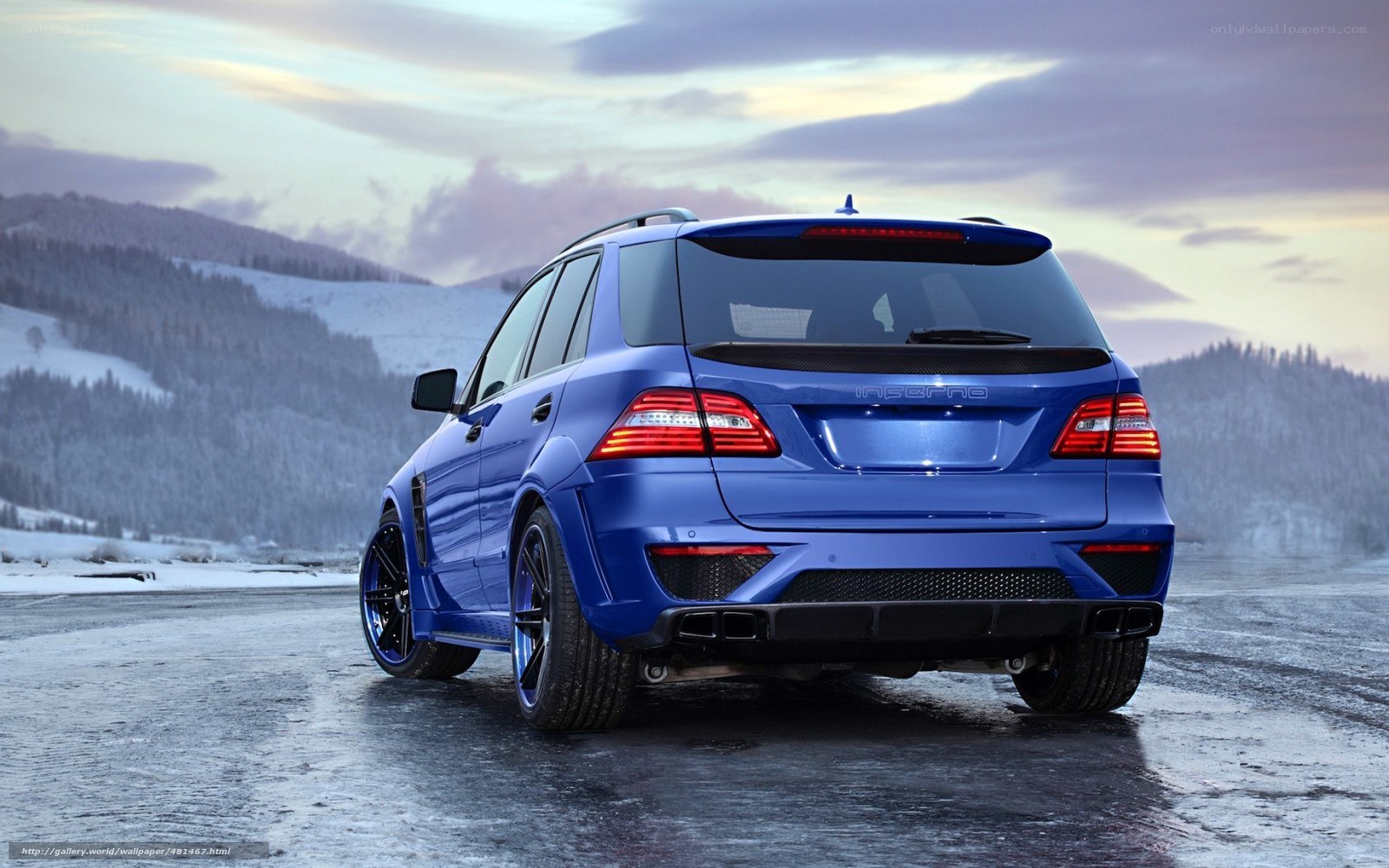 blue SUV on snowy road