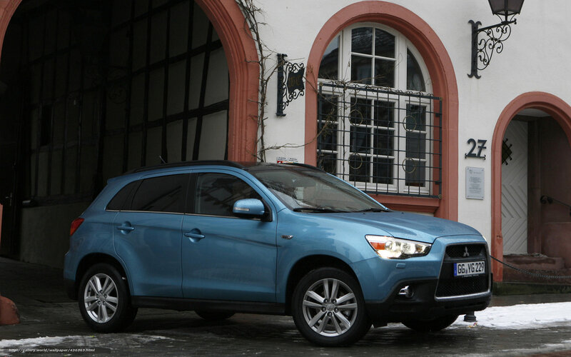 Blue SUV parked in front of building