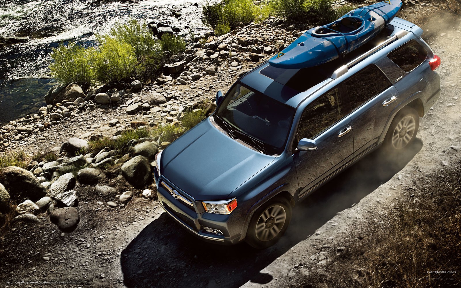 Blue SUV with kayak on roof