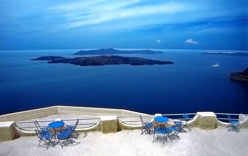 Blue tables overlooking the sea