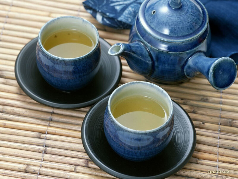 Blue tea set on bamboo mat
