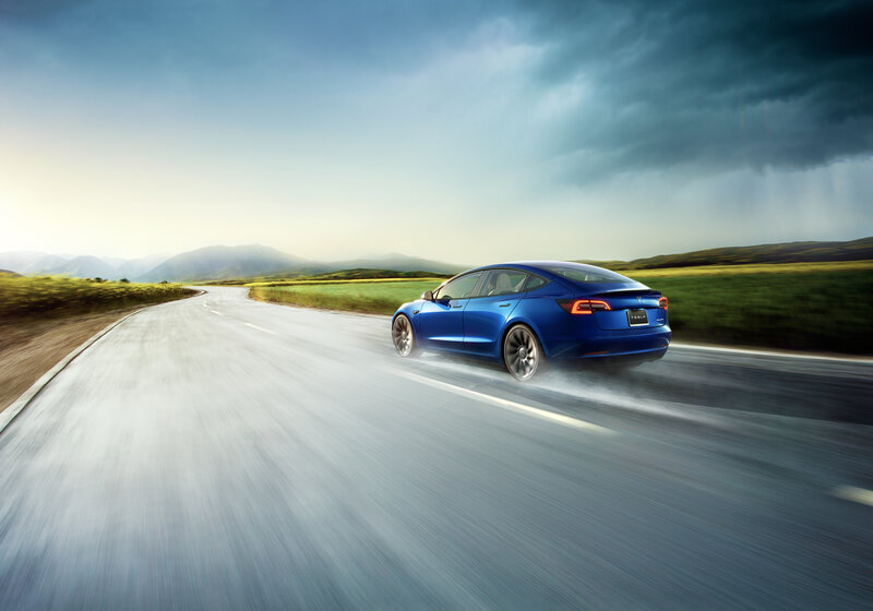 Blue Tesla Model 3 — Dramatic