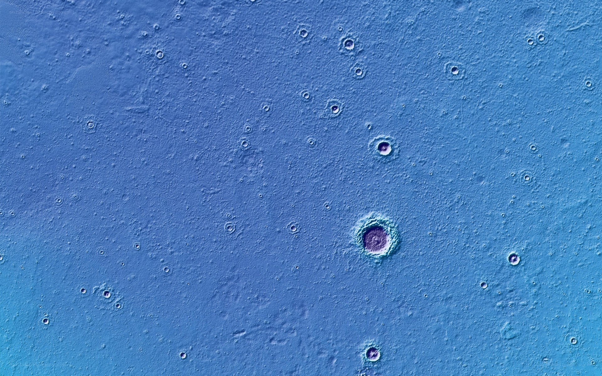 blue textured surface with craters