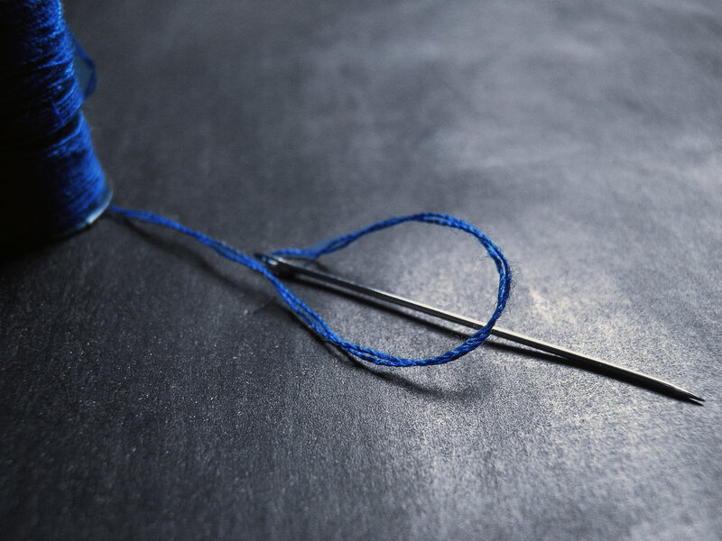Blue thread and needle