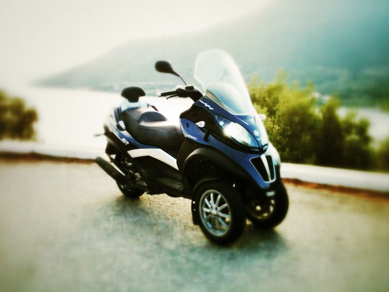 Blue Three-wheeled Scooter — Serene