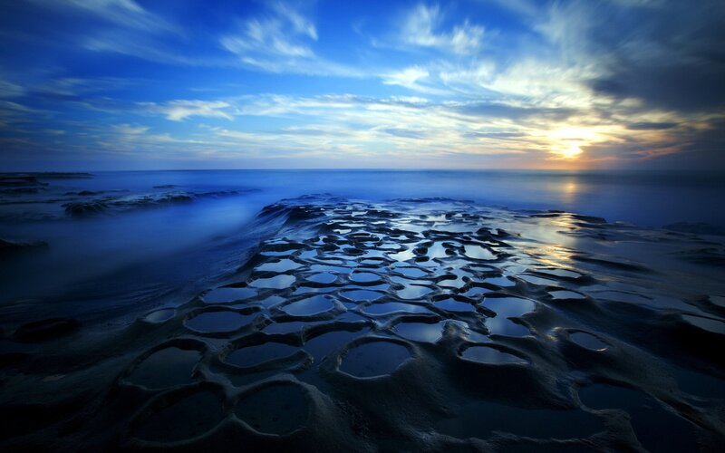 Blue tide pools at sunset