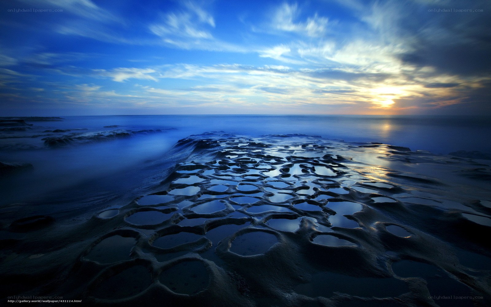 Blue tide pools at sunset