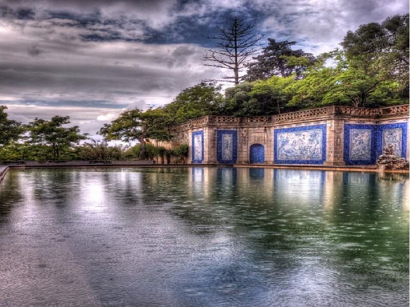 Blue-tiled wall by a pond