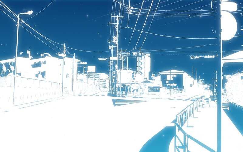 blue-tinted city street at night