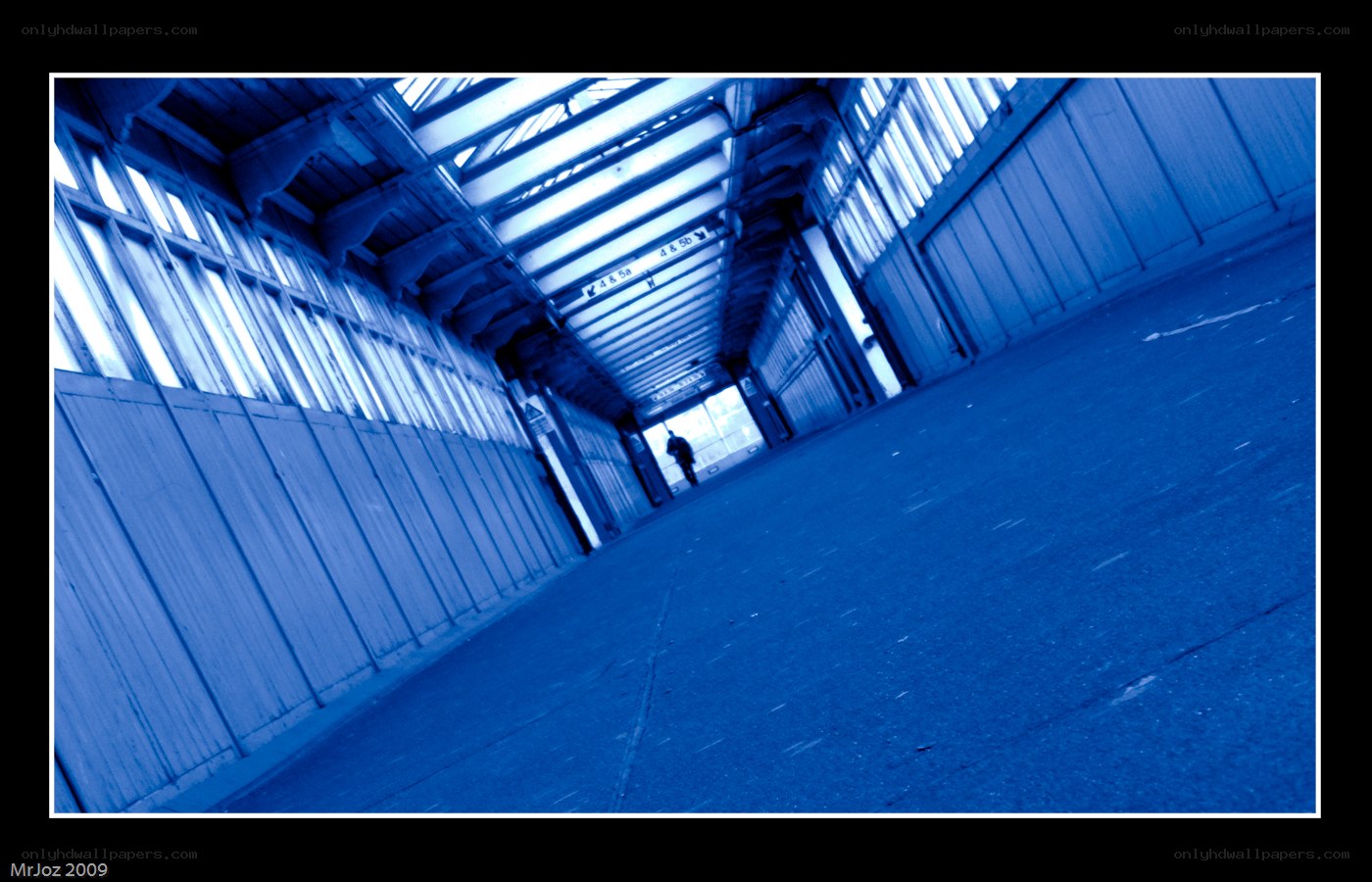 blue-tinted corridor with person
