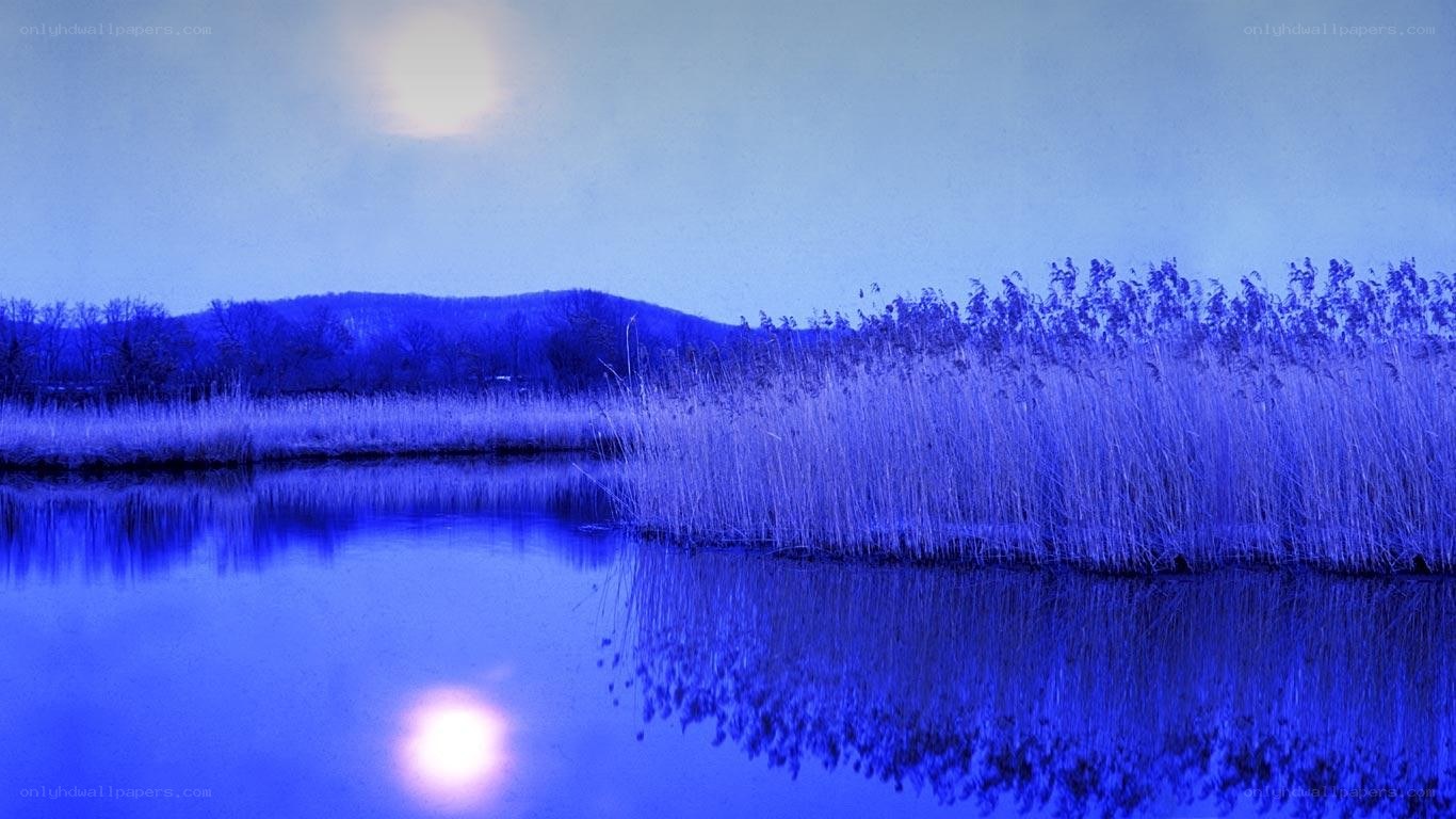 Blue-toned lake at dusk