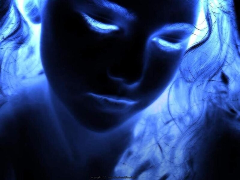 Blue-toned portrait of a woman