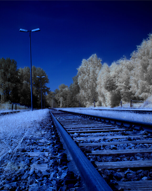Blue-toned railway at night