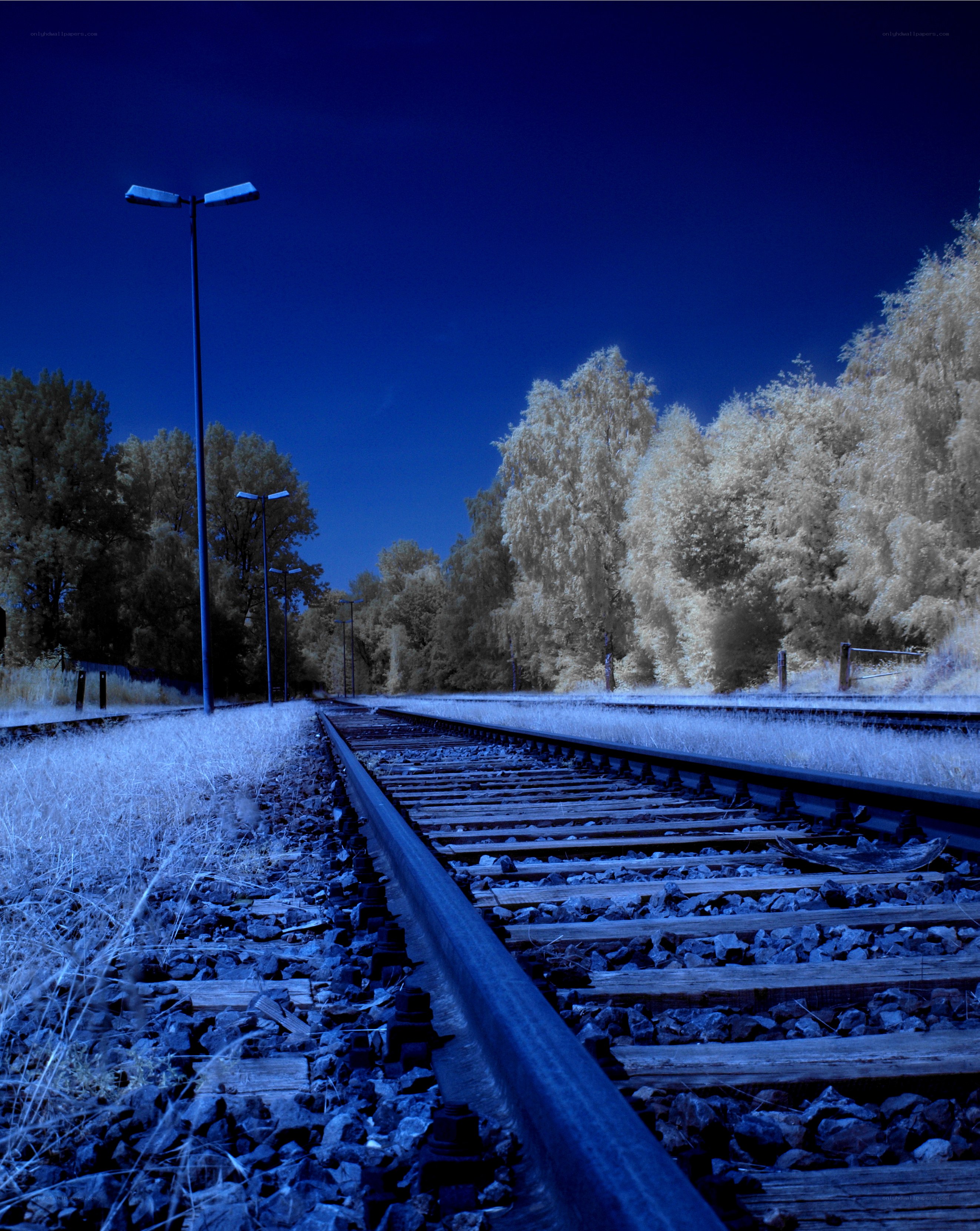 Blue-toned railway at night