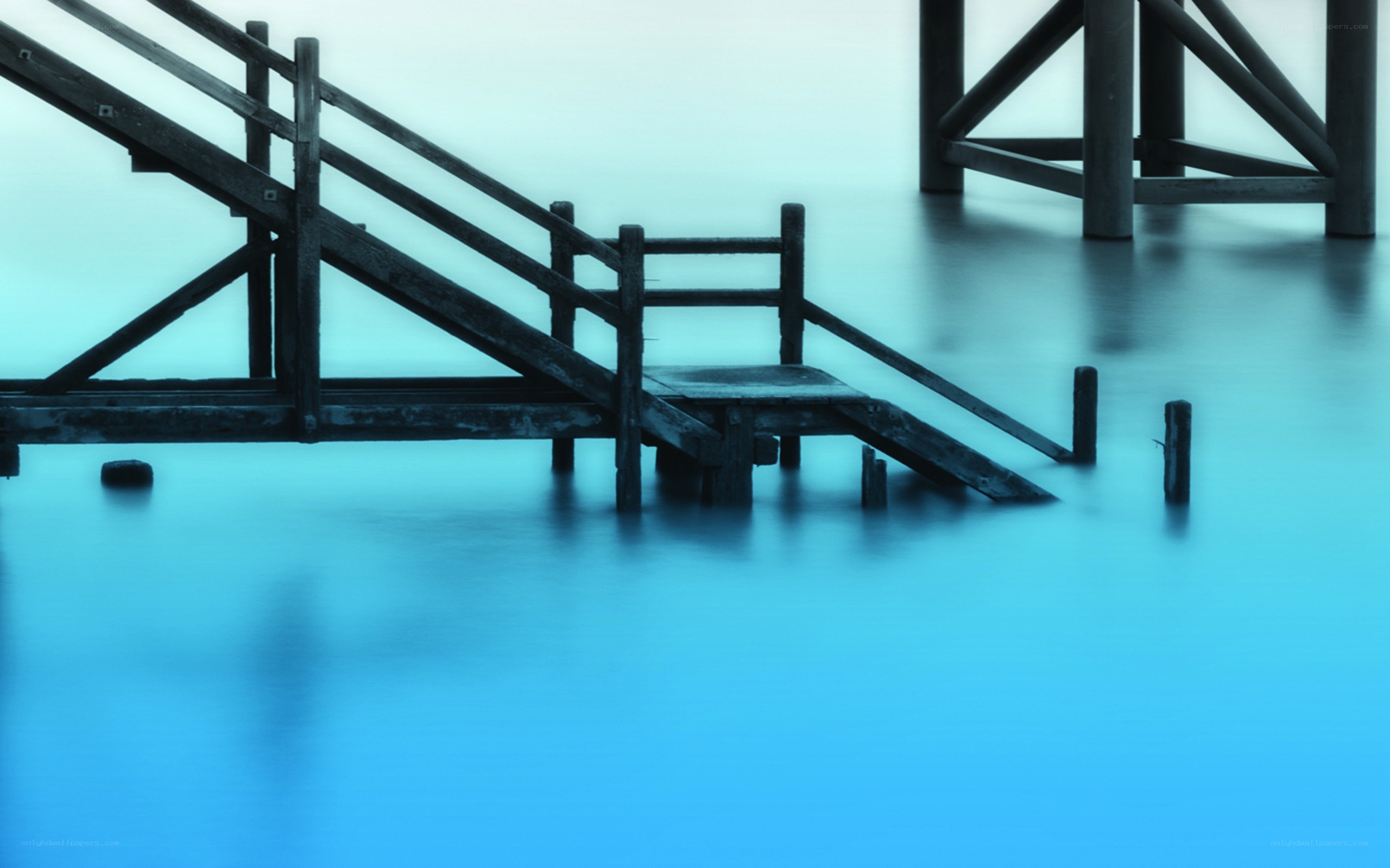 Blue-toned wooden pier structure