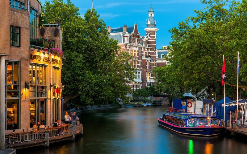 Blue Tour Boat on Canal — Serene, Sunset