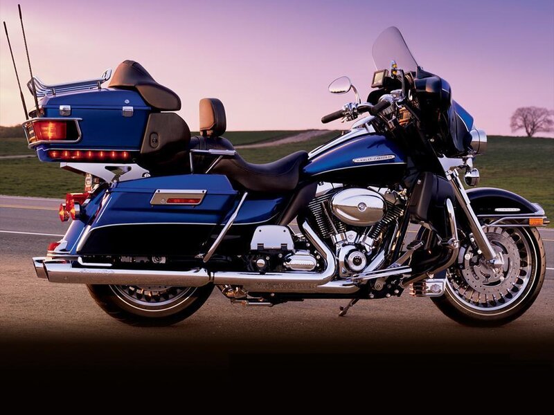 blue touring motorcycle on road