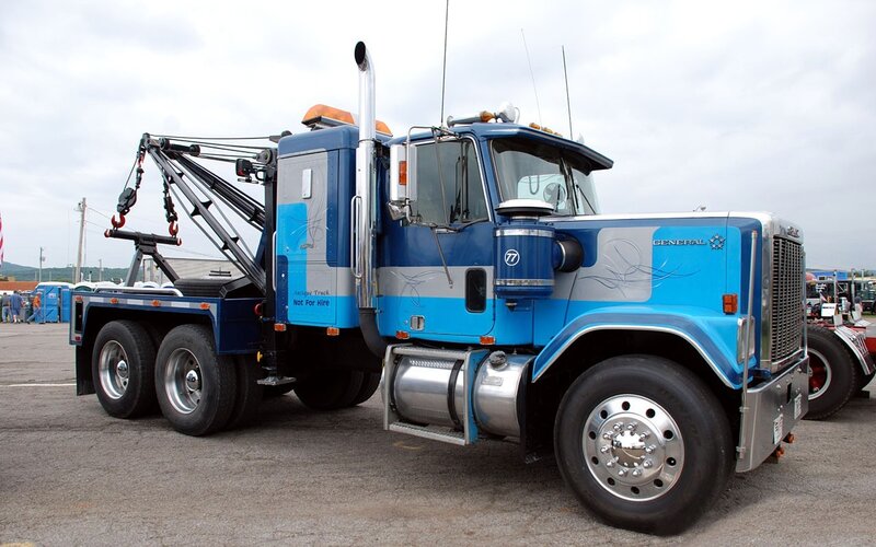 blue tow truck with crane