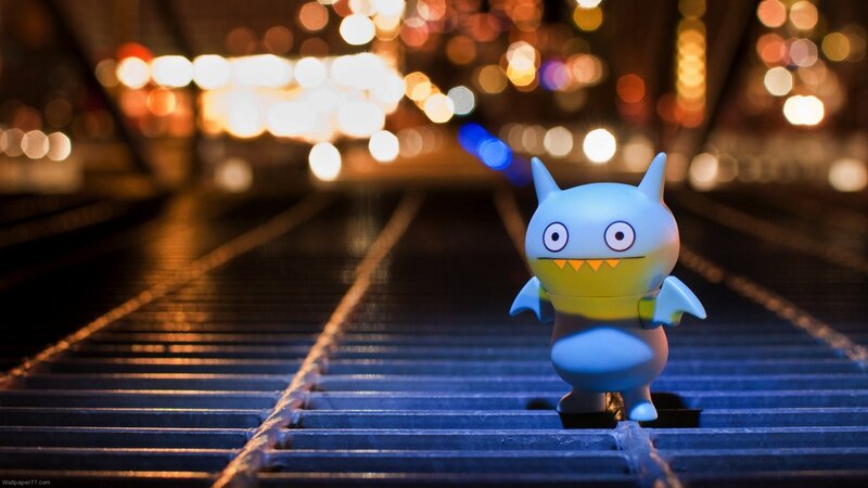 Blue Toy Figure on Tracks