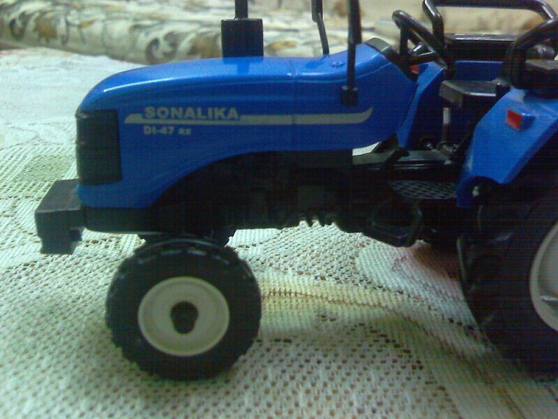 Blue Toy Tractor — Neutral, Photograph, Carpet