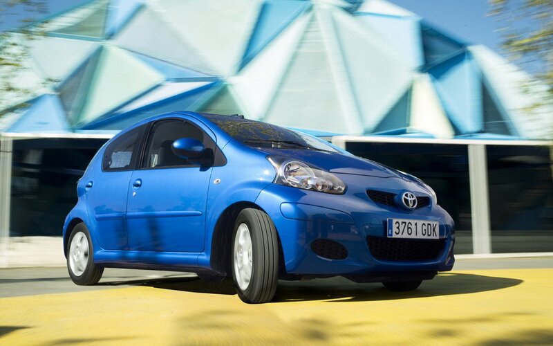 Blue Toyota Aygo in motion