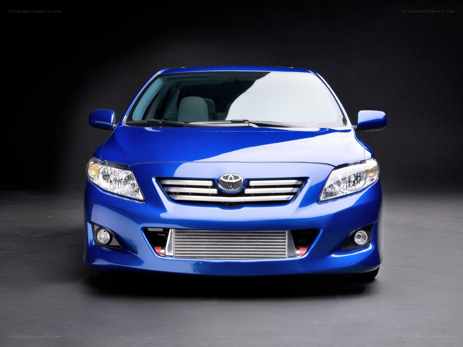 blue toyota corolla front view