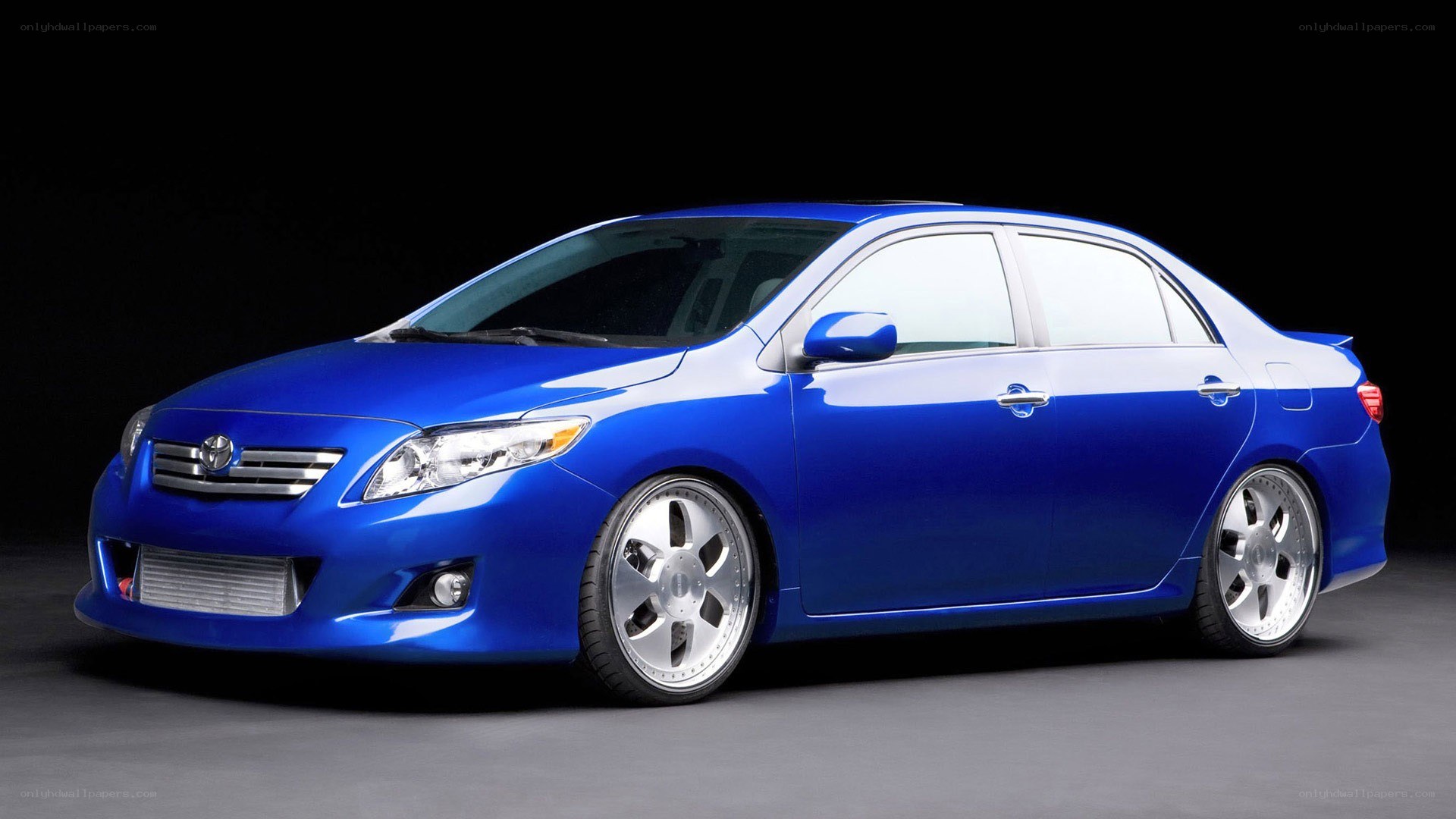 blue toyota corolla sedan