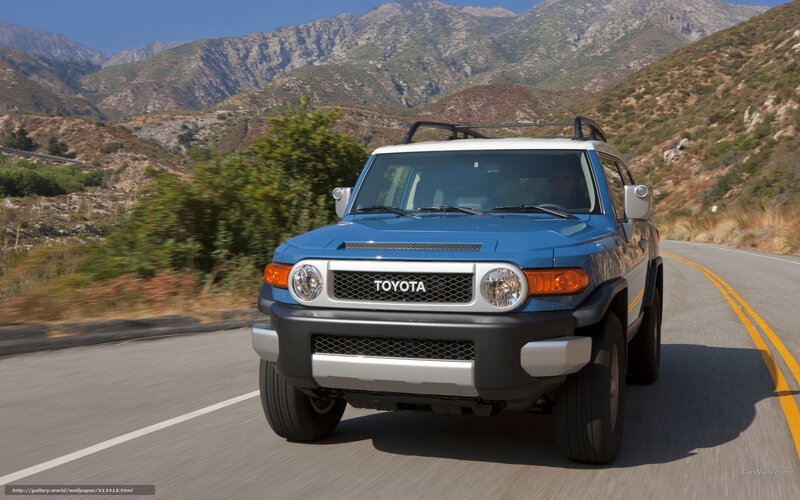 Blue Toyota FJ Cruiser on mountain road