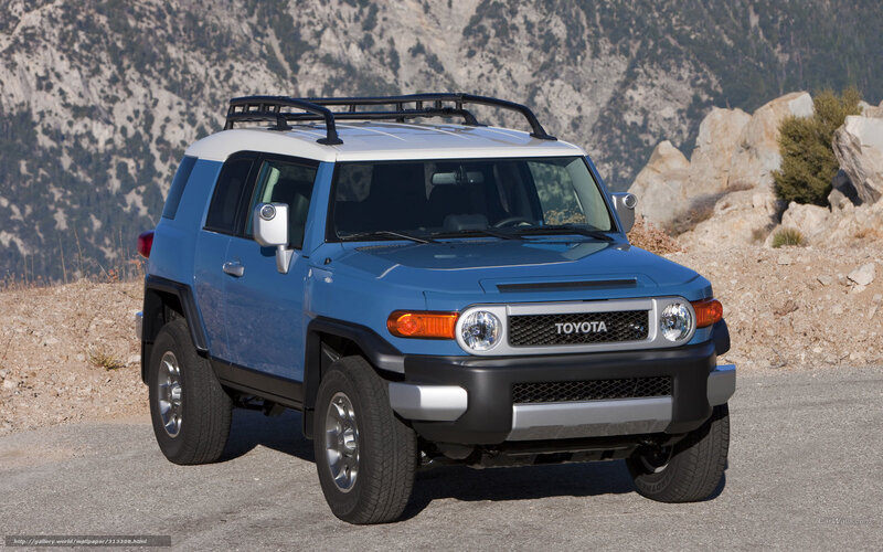 Blue Toyota FJ Cruiser on mountain road