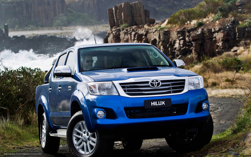 Blue Toyota Hilux by the coast