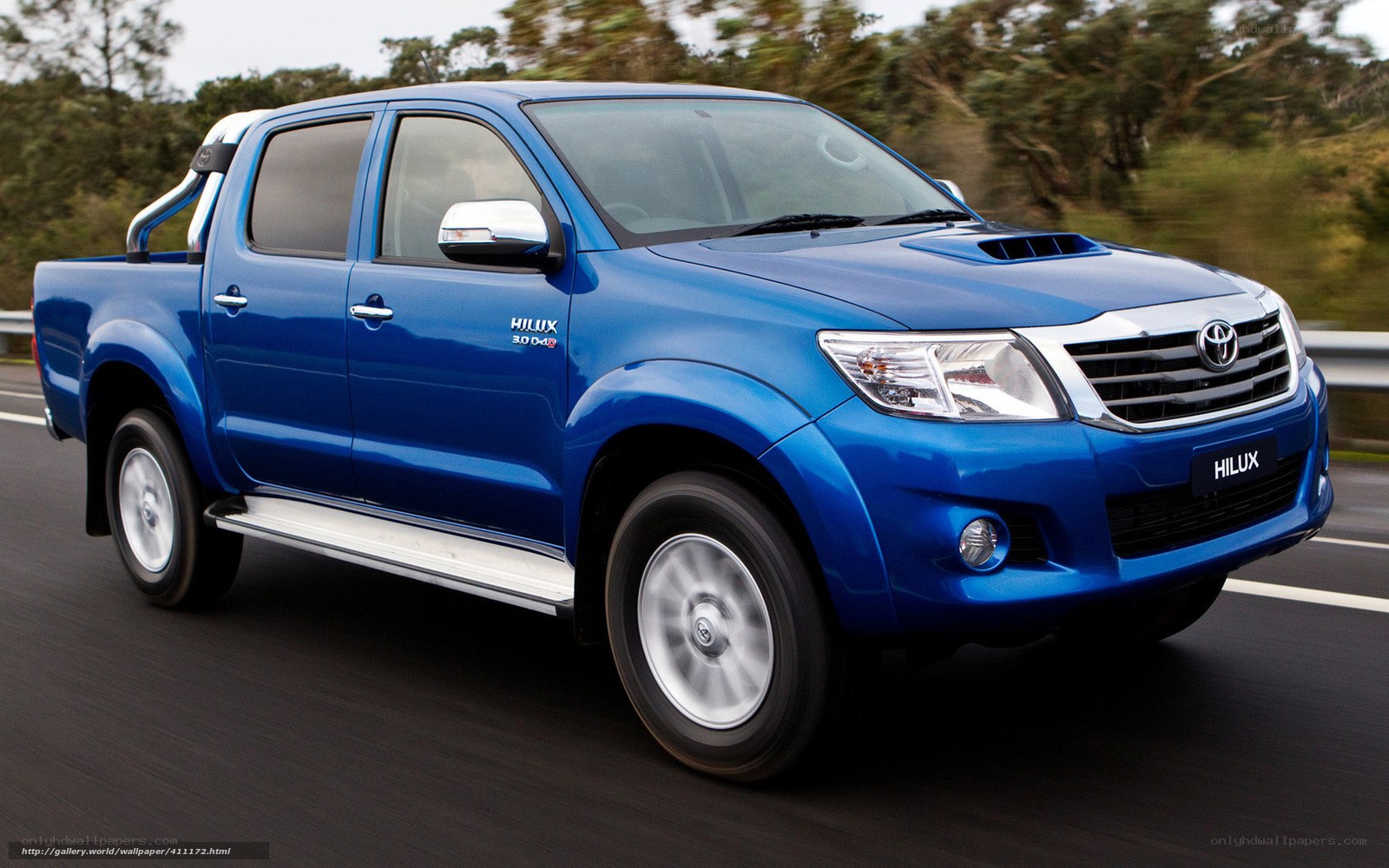 Blue Toyota Hilux in motion