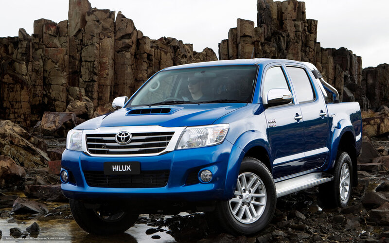 Blue Toyota Hilux on rocky terrain
