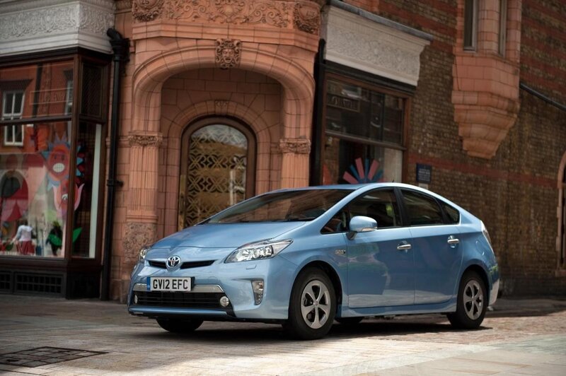 Blue Toyota Prius on city street