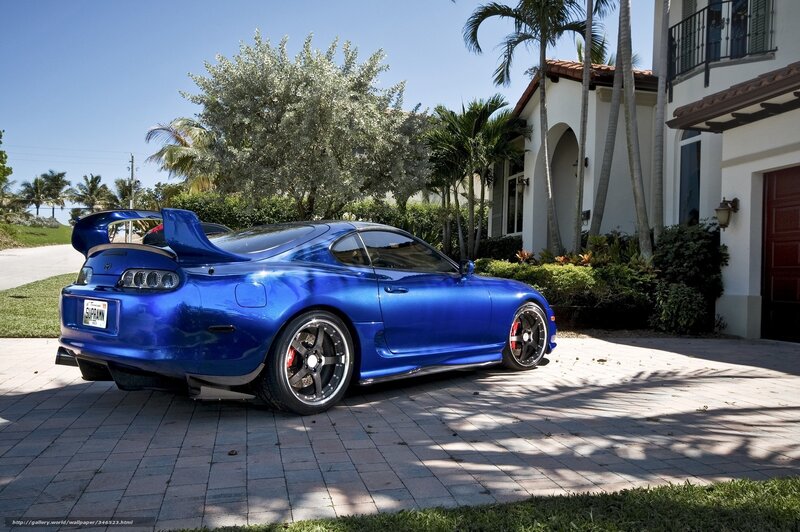 Blue Toyota Supra in driveway