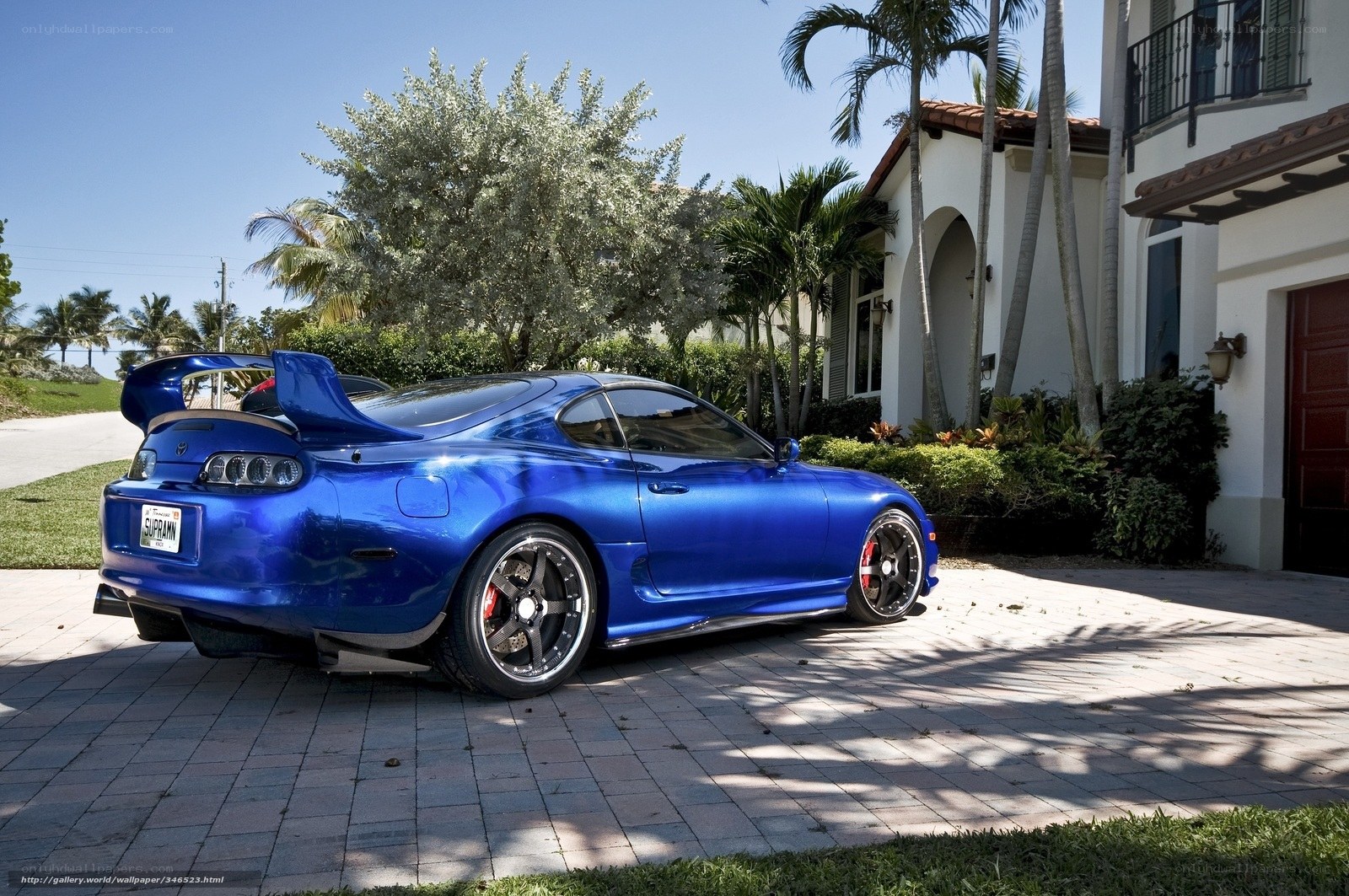 Blue Toyota Supra in driveway
