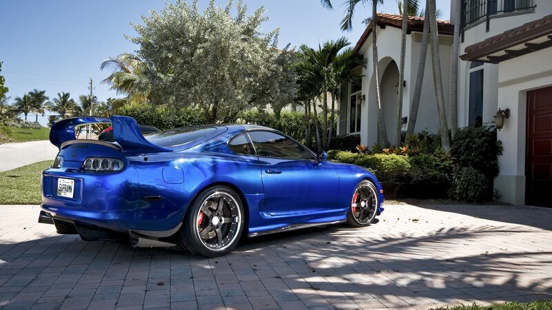 Blue Toyota Supra parked outside