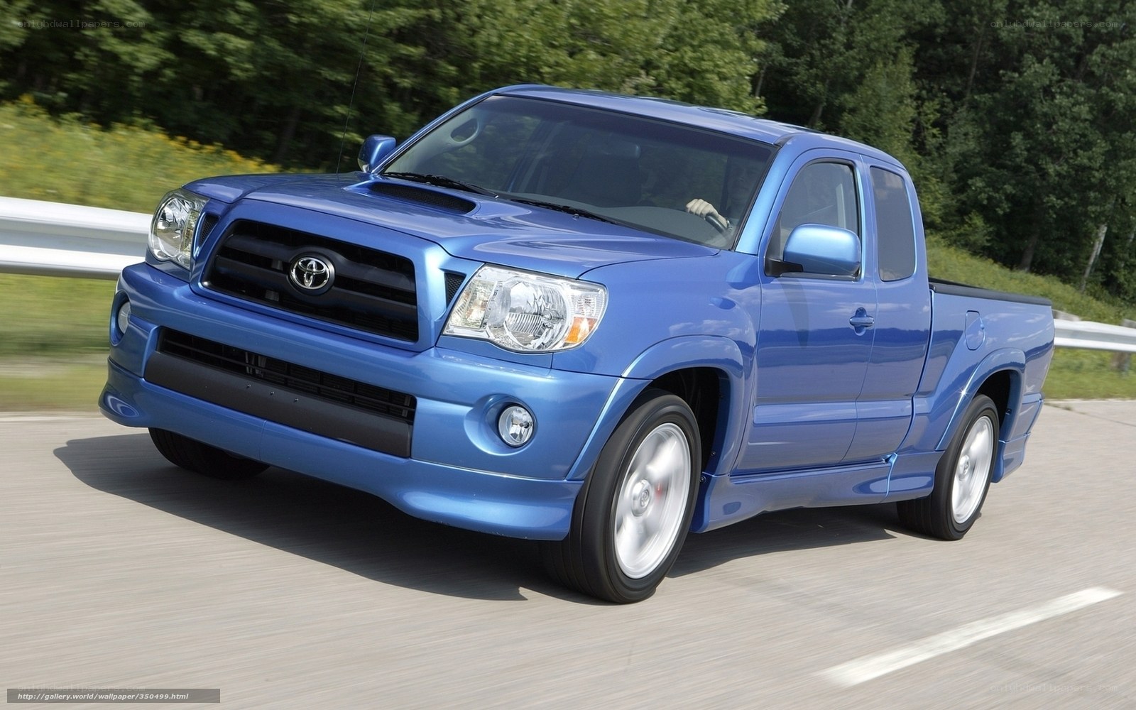 blue toyota tacoma in motion