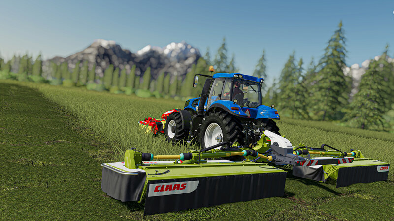 Blue Tractor Mowing Grass