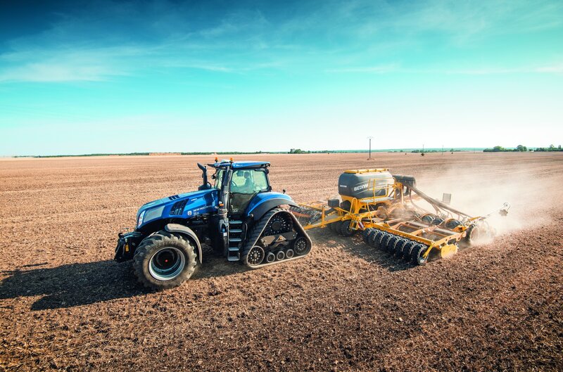 Blue Tractor Plowing Field — Active, Afternoon