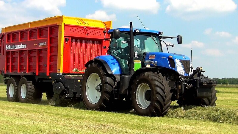 Blue Tractor Pulling Trailer