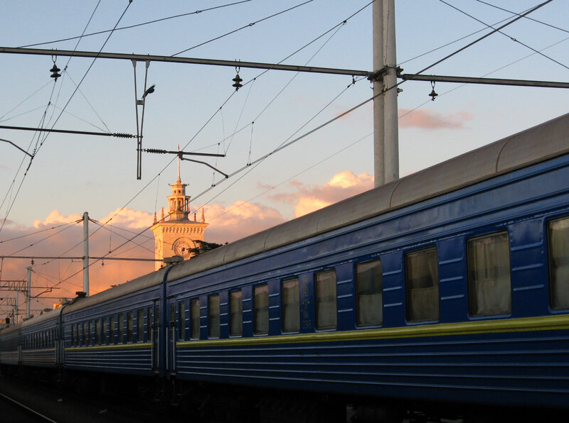 Blue train at sunset