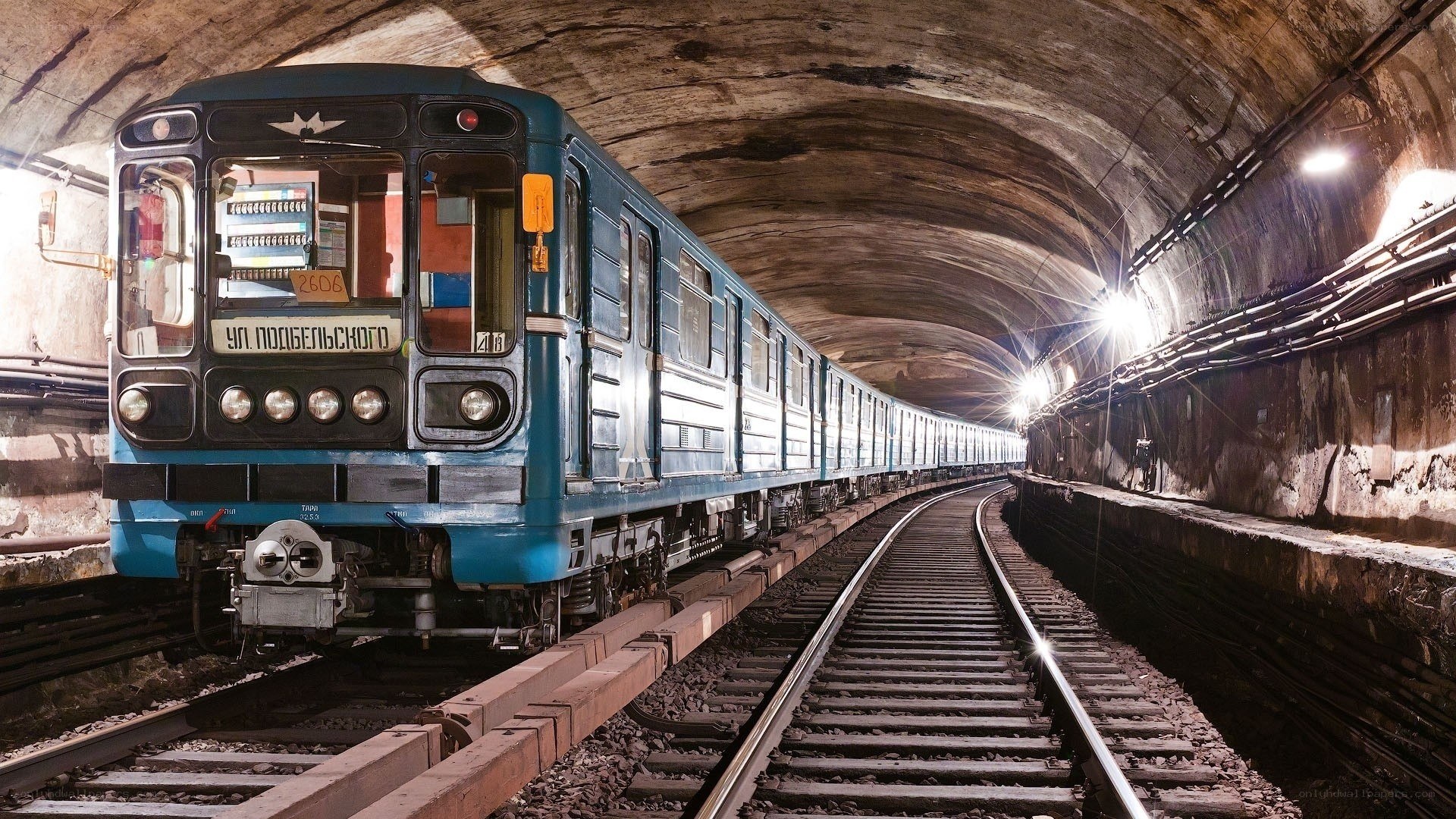 Blue train in underground tunnel