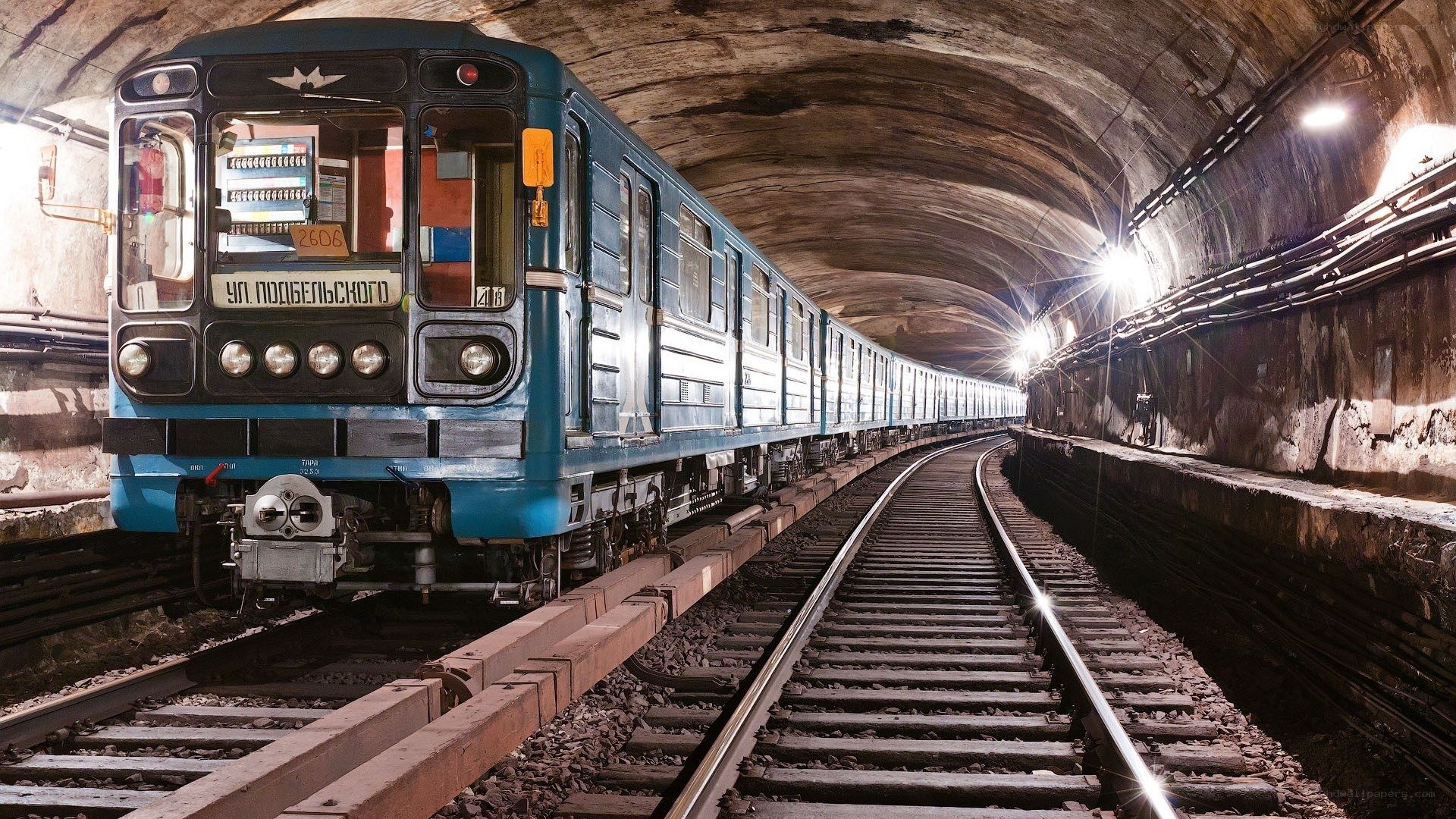 Blue train in underground tunnel