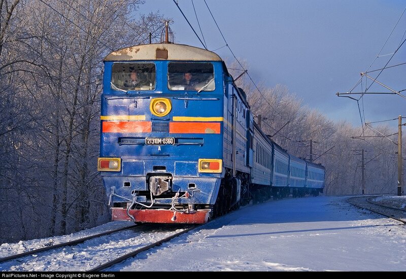 Blue train in winter landscape